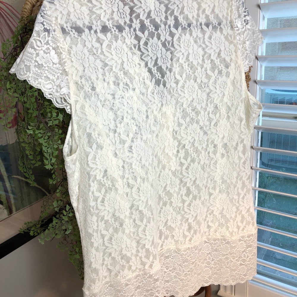 Off white sleeveless lace top.